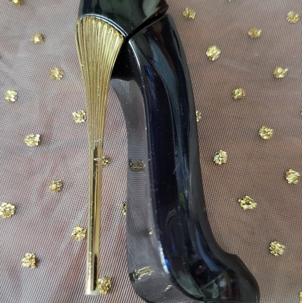 empty small bottle of Carolina Herrera Good Girl Eau de Parfum